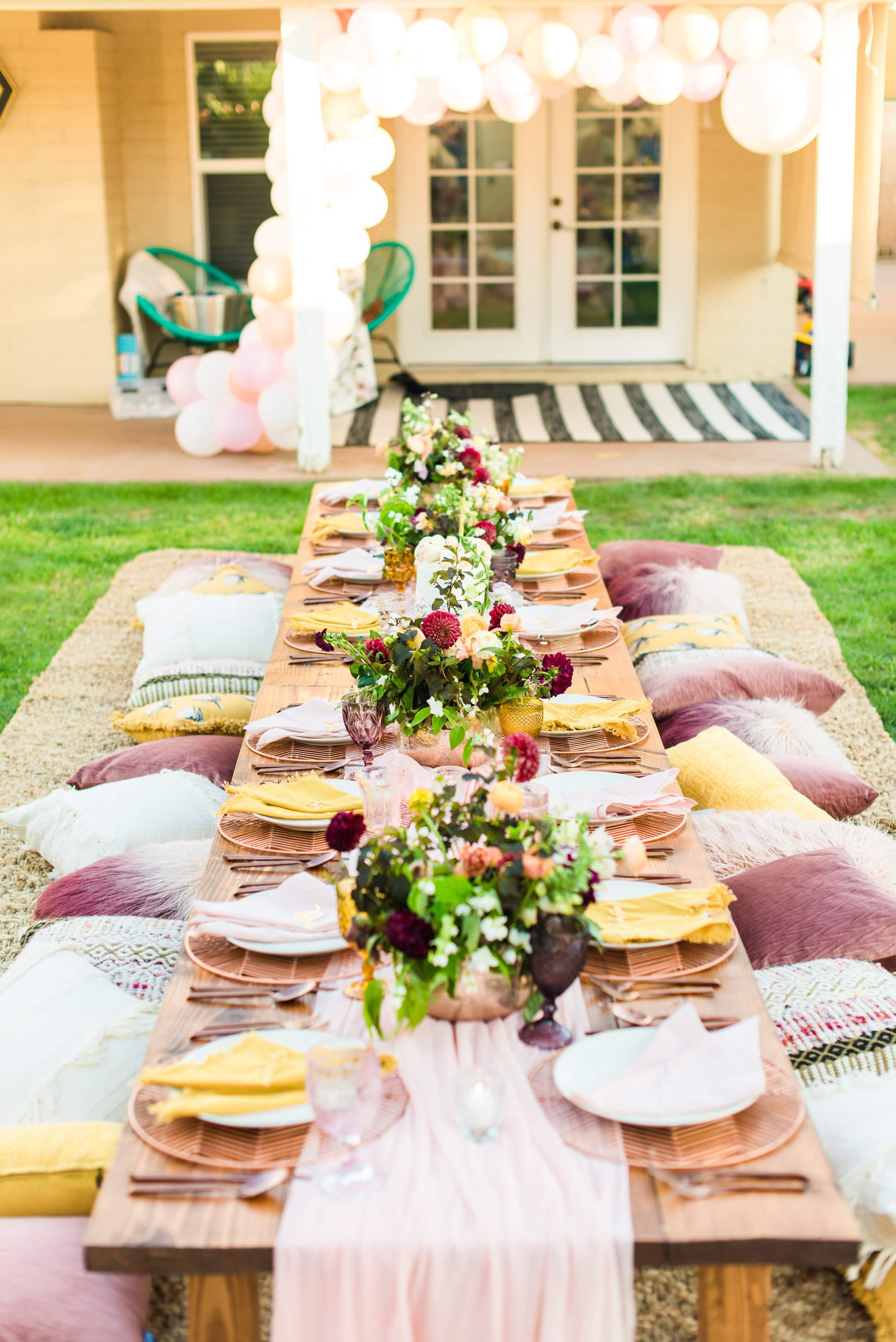 Colorful Long Outdoor Table with Pillow Seating Boho