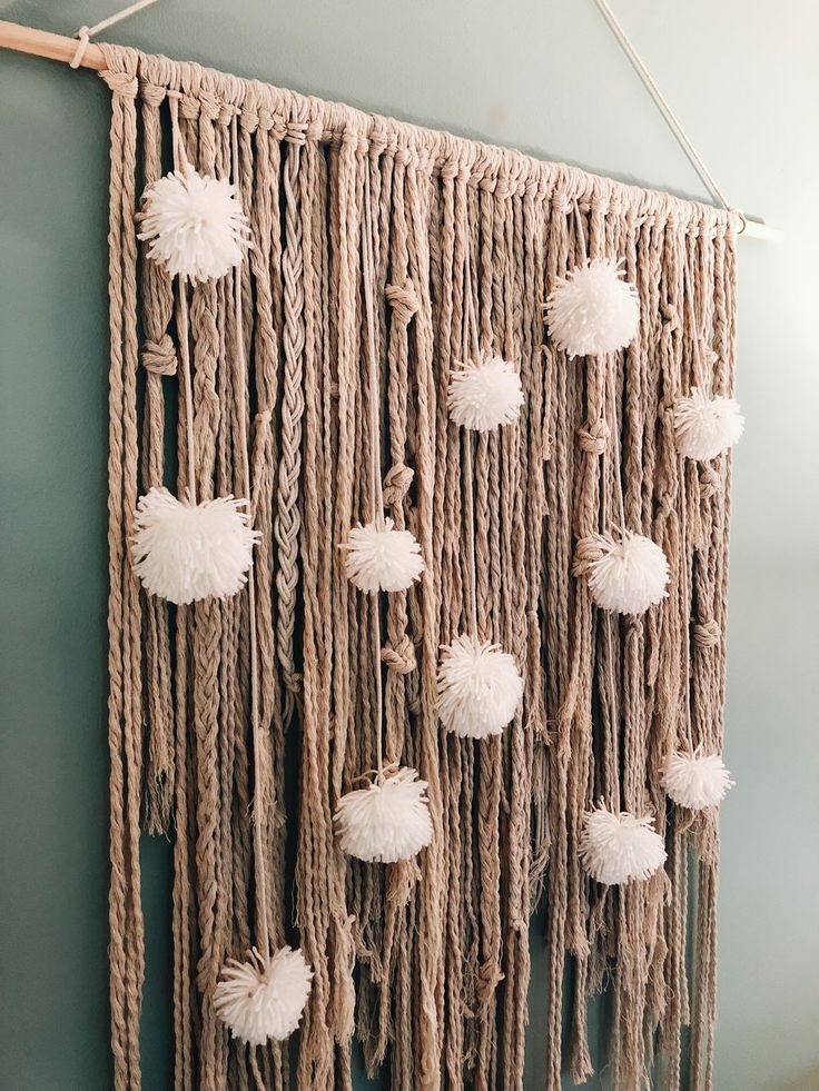 Rope and Pom Wall Hanging by Wall